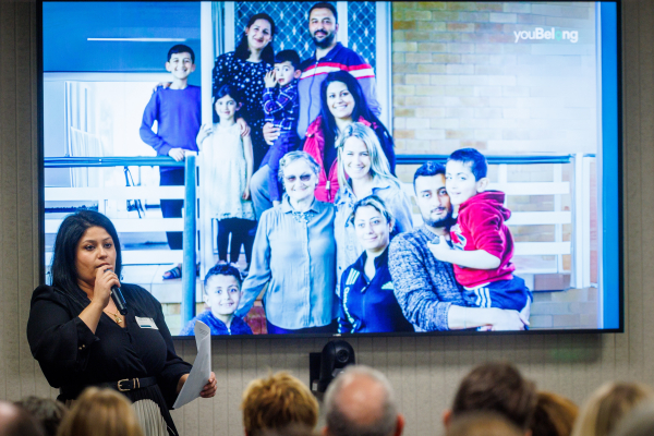 Kinda Flaha speaking in front of the Equity and Inclusion audience